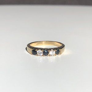Gold Tone Ring with Black Diamonds and White Stone